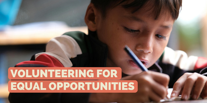 Featured photo: Volunteering for more equal opportunities - a young boy sits at the table and writes.